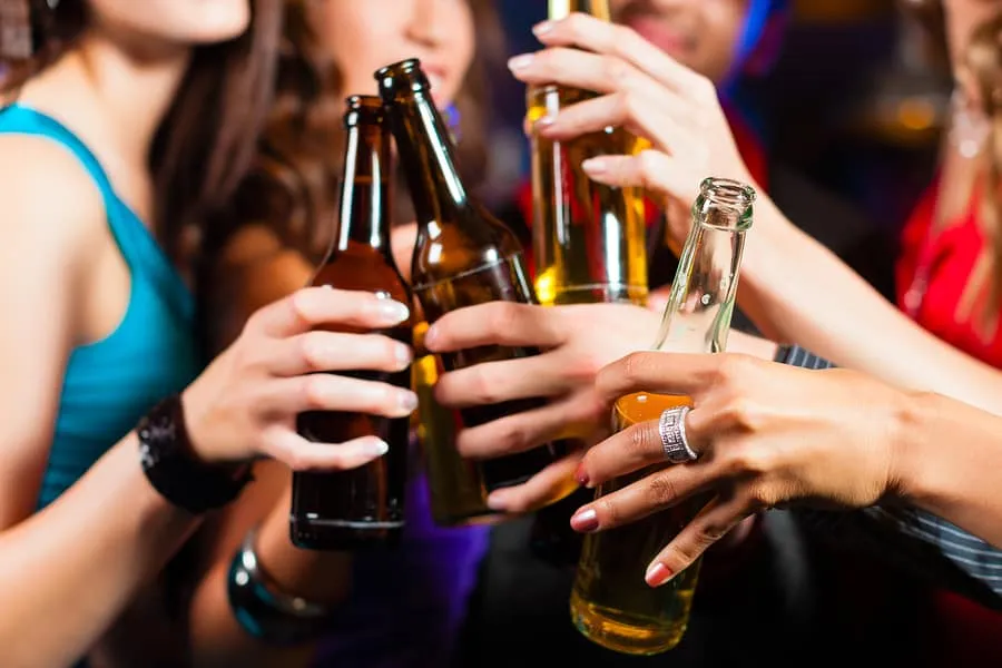 men and women drinking beer